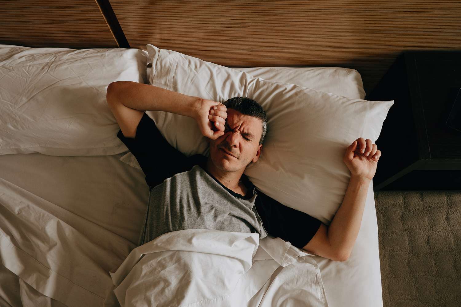 person waking up tired after full night sleep